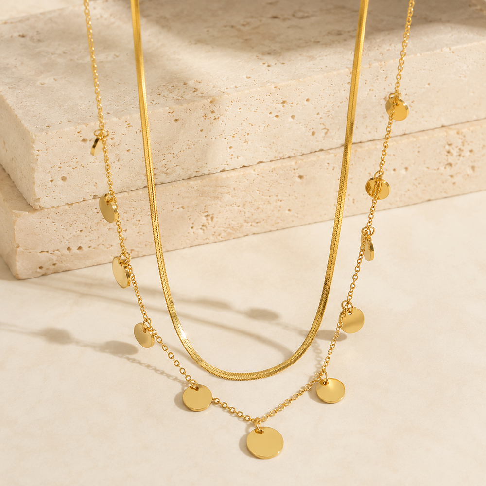 18k Stainless Steel Tarnish Free Disc Necklace on cream stone display