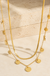 18k Stainless Steel Tarnish Free Disc Necklace on cream stone display