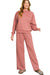 Woman wearing a pink tracksuit labeled 'Winter Rose' on a white background