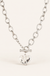 Hammered heart necklaces on warm cream background