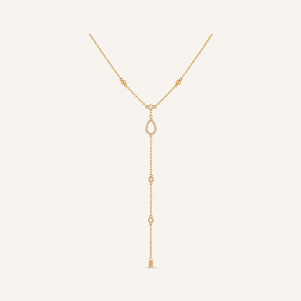 Rhinestone Y necklace on warm cream background