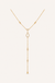 Rhinestone Y necklace on warm cream background