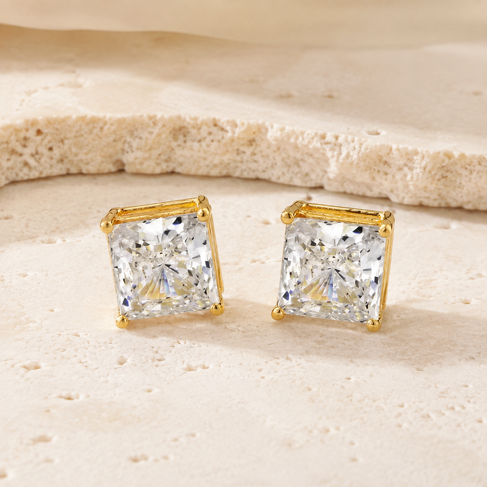 7mm 10K Gold Square Stud Earrings on cream stone background