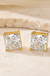 7mm 10K Gold Square Stud Earrings on cream stone background