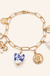 Porcelain bow and heart charm necklace on warm cream background