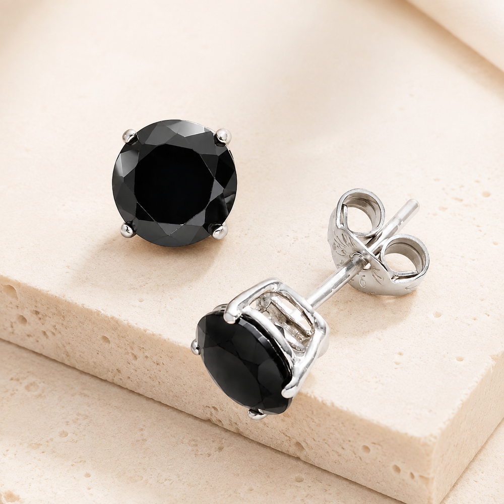 925 Sterling Silver Round Studs Black on cream stone background