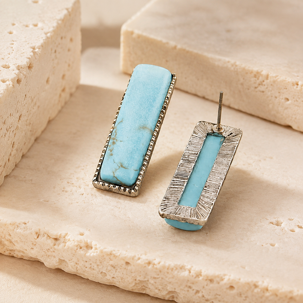 Antique Stone Earrings on cream stone display