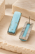 Antique Stone Earrings on cream stone display