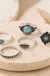 Antique Stone Rings Set on cream stone display
