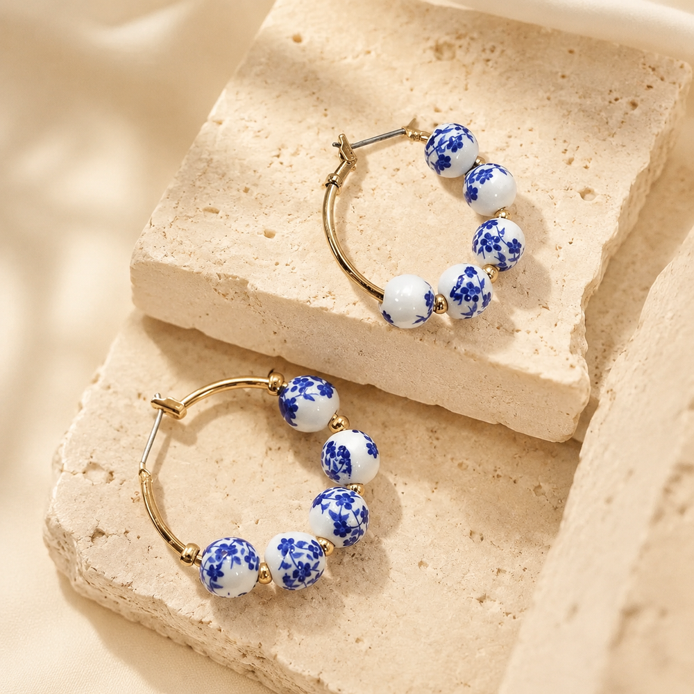 Blue Ceramic Porcelain Hoop Earrings on cream stone display