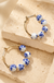 Blue Ceramic Porcelain Hoop Earrings on cream stone display