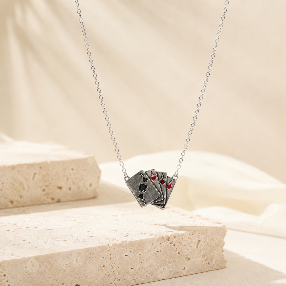 Four Of Aces Necklace on cream stone display