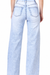 Light acid wash wide-leg jeans back view on white background