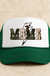 Mama Bolt Cowhide and Camo Trucker Hat on cream stone - LECCE catalog