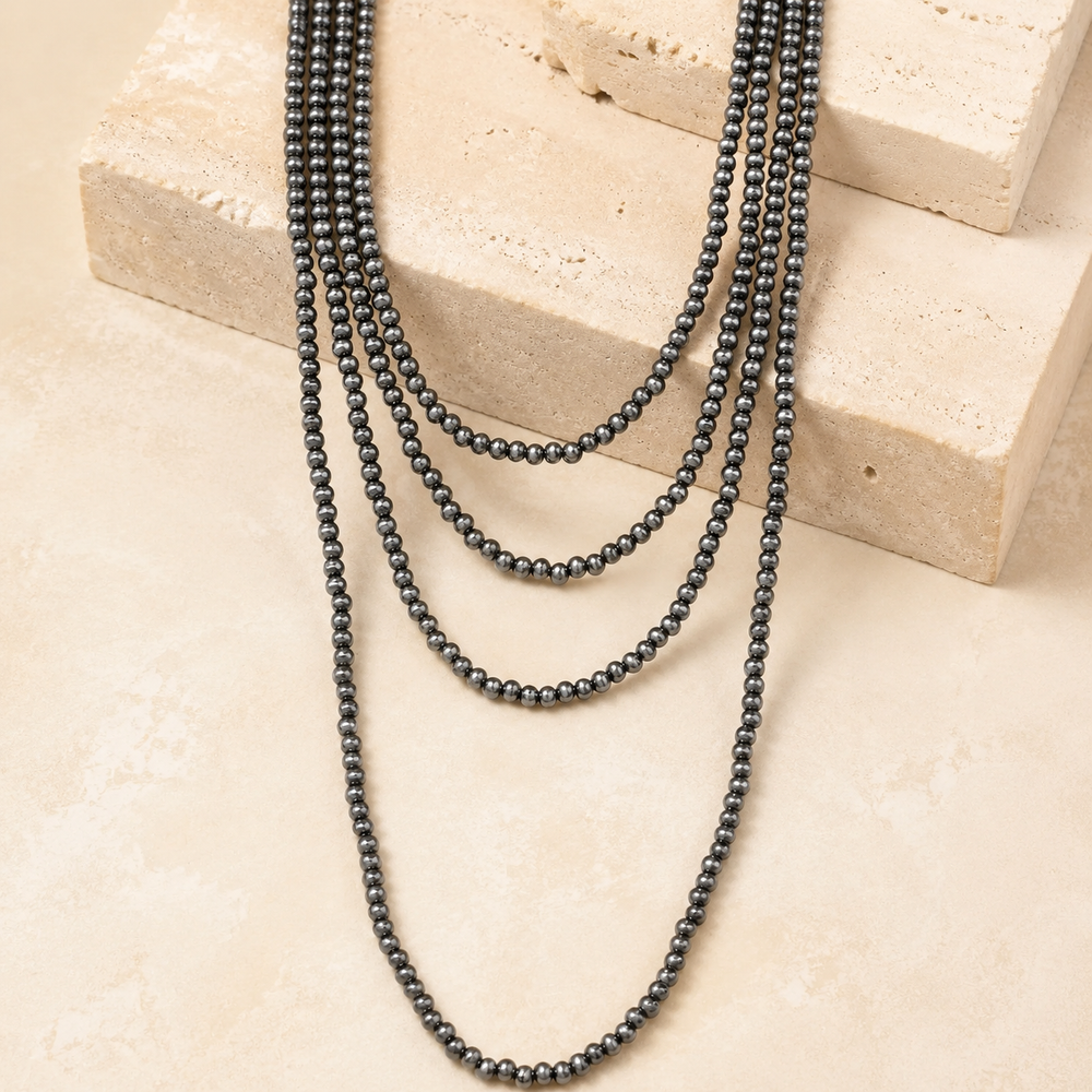 Multi Layered Tiny Western Navajo Pearl Necklace on cream stone display