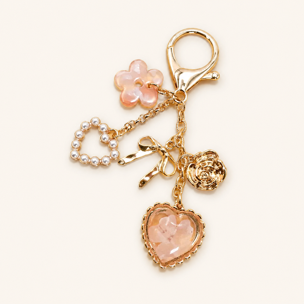 Pressed Flower Bow Pearl Heart Bag Charm on soft-white background