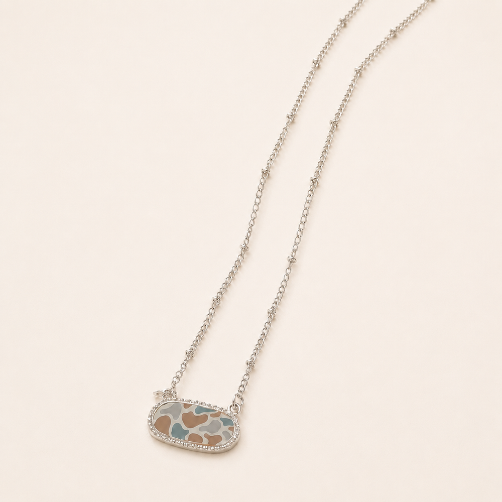 Silver Camo Necklace on soft-white background