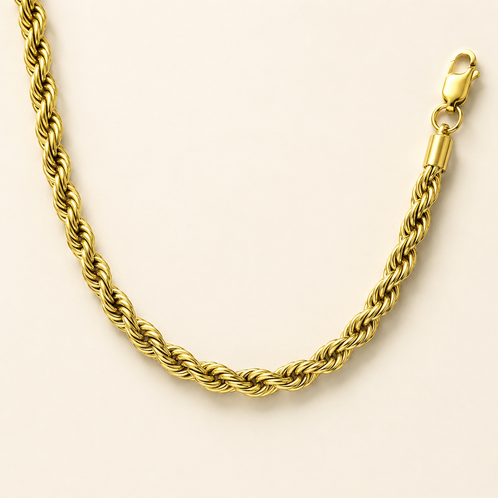 Gold stainless steel 5mm rope chain on ivory background