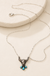 Western Steerhead Turquoise Pendant Necklace on a warm cream stone display