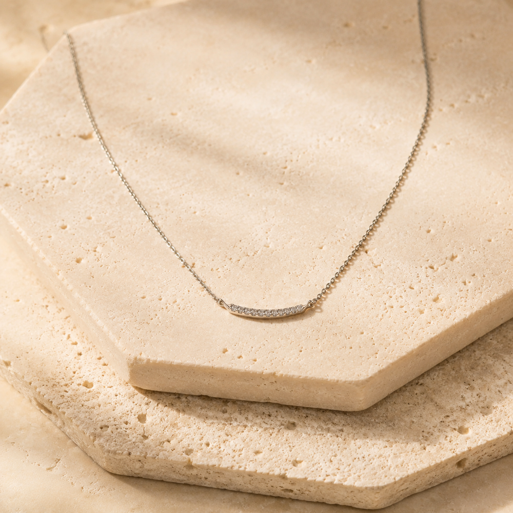 Sterling Silver Bar Necklace on cream stone background