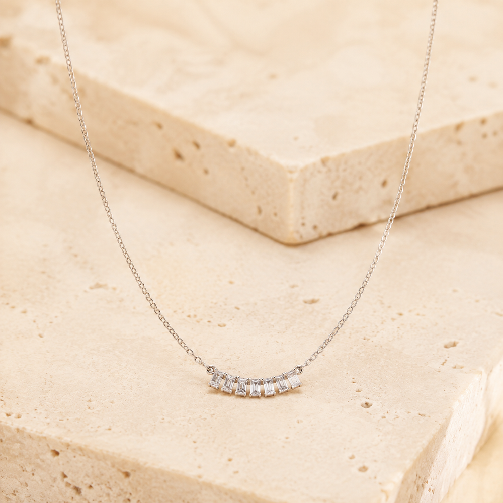 Sterling Silver Flowers Necklace on cream stone background