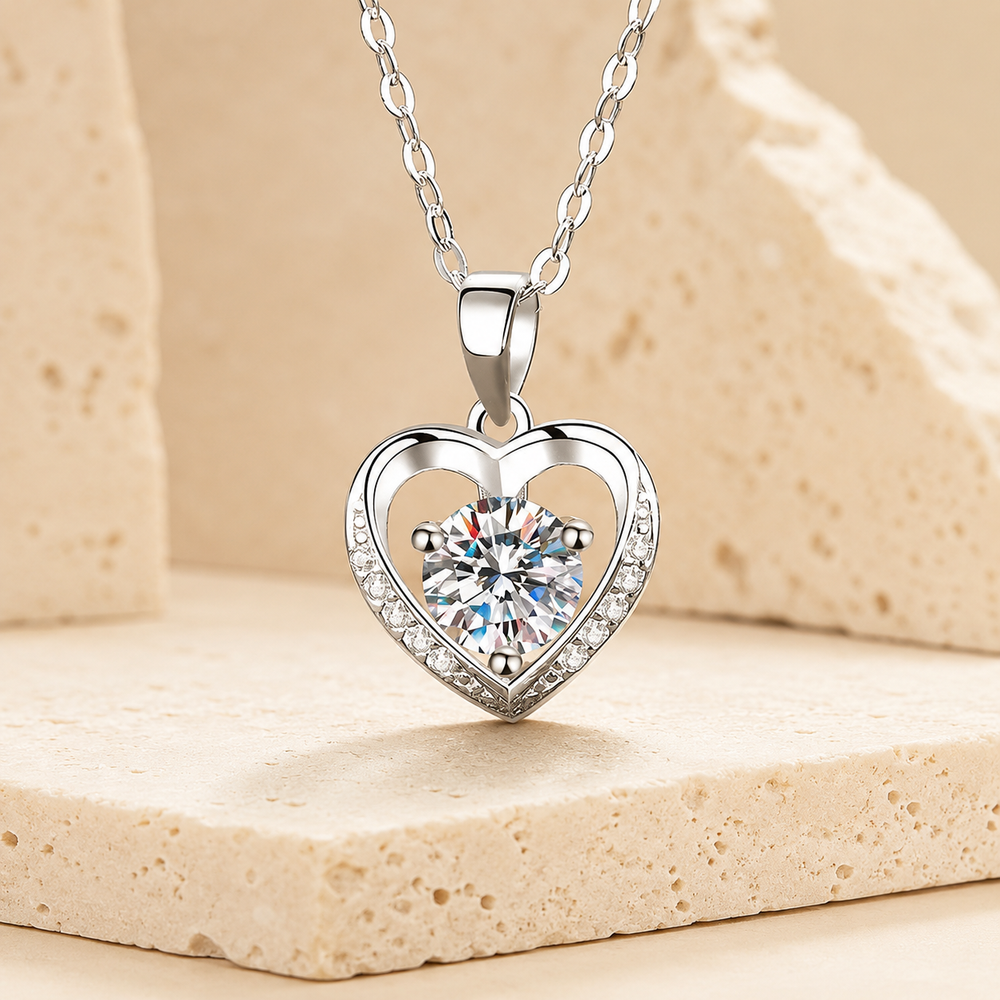 Sterling Silver Moissanite Heart Pendant Necklace on cream stone background