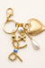 Porcelain Bow Heart Teddy Bear Bag Charm on soft-white background