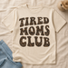 Tired Moms Club T-shirt flat lay