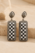 Western Checker Bar Design Earrings on cream stone display