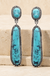 Western Concho Linear Oval Gem Stone Drop Earrings on cream stone background