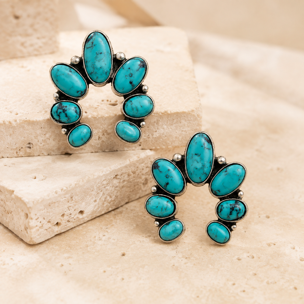 Western Gemstone Squash Blossom Stud Earring on cream stone display