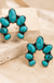 Western Gemstone Squash Blossom Stud Earring on cream stone display