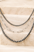 Western Navajo Pearl Clip Chain Necklace on cream stone background