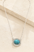 Western Turquoise Oval Necklace on cream stone display
