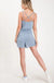 Textured solid color spaghetti strap jumpsuit with drawstring waist. LECCE