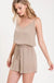 Textured solid color spaghetti strap jumpsuit with drawstring waist. LECCE
