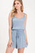 Textured solid color spaghetti strap jumpsuit with drawstring waist. LECCE