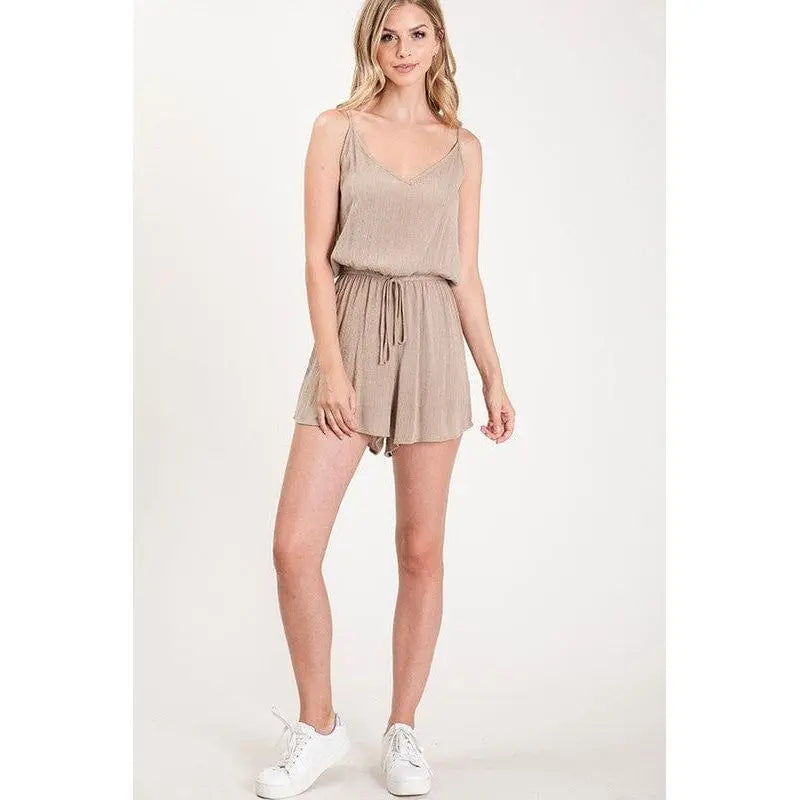 Textured solid color spaghetti strap jumpsuit with drawstring waist. LECCE