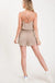 Textured solid color spaghetti strap jumpsuit with drawstring waist. LECCE